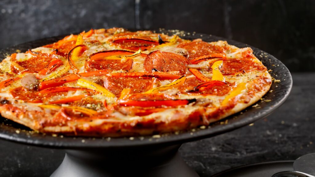 cuanto cuesta hacer una pizza​